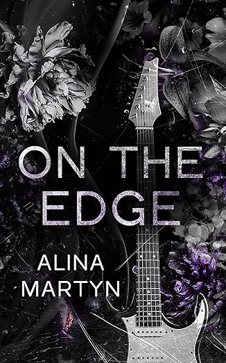 a book cover with a guitar and flowers